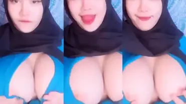 Bokep Jilbab Pamer Dada Montok Tanpa Bra poster
